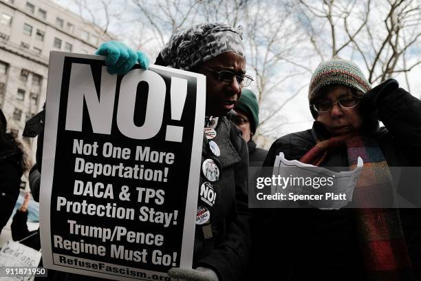 Dozens of immigration activists, clergy members and others participate in a protest against the imprisonment and potential deportation of immigration...