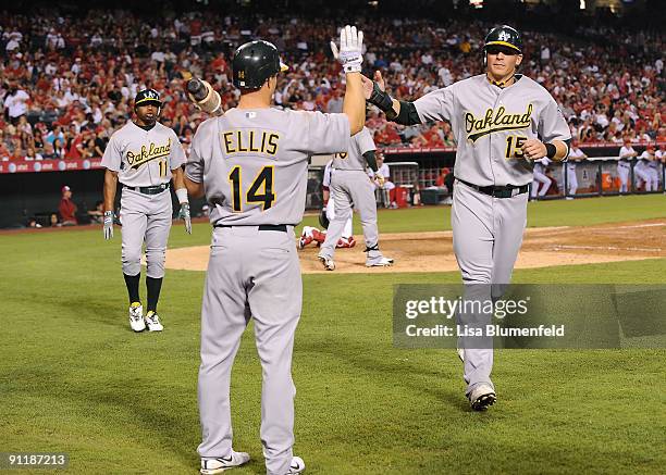 Ryan Sweeney of the Oakland Athletics scores in the fifth inning against the Los Angeles Angels of Anaheim at Angel Stadium of Anaheim on September...