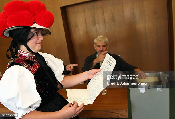 Claudia Lutz of Kirnbacher Kurrende Black Forest costume club arrives for casting her vote for the German federal elections on September 27, 2009 in...