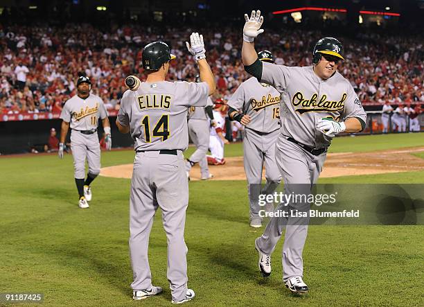 Jack Cust of the Oakland Athletics celebrates after hitting a three run homerun in the fifth inning against the Los Angeles Angels of Anaheim at...