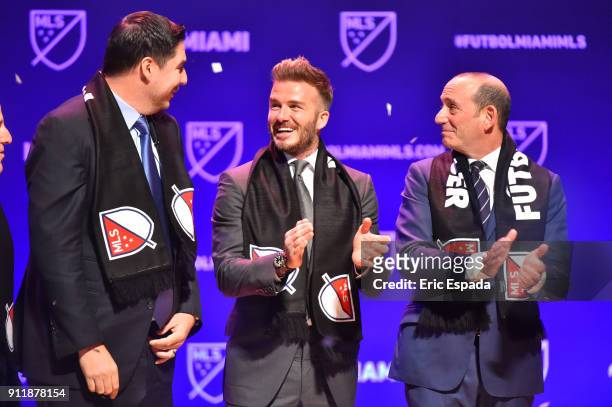 David Beckham with Don Garber, MLS Commissioner and Marcelo Claure, CEO of Sprint after being presented with a scarf after officially awarding the...