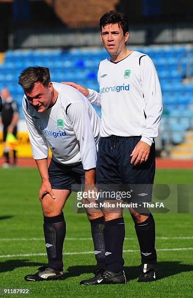 Labour cabinet ministers Ed Balls and Andy Burnham feel the heat during the annual Labour MPs v Press Lobby football match at the Withdean Stadium on...
