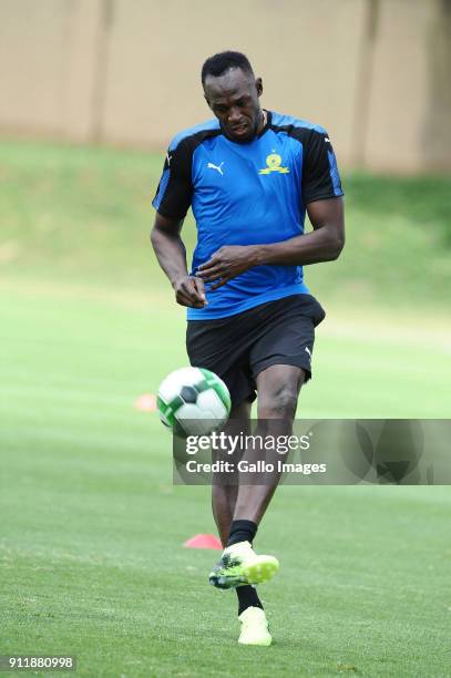 Retired Jamaican athletic superstar Usain Bolt joins the Mamelodi Sundowns Training Session at Chloorkop on January 29, 2018 in Pretoria, South...