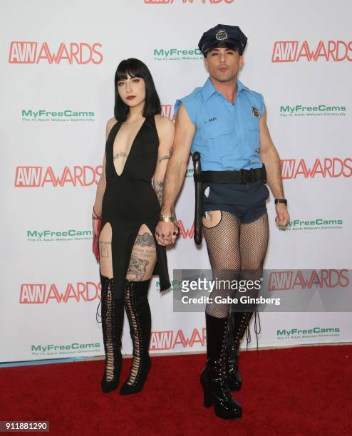 Adult film actress Charlotte Sartre and adult film actor Lance Hart, dressed like a police officer, attend the 2018 Adult Video News Awards at the...