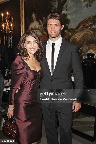 Caterina Murino and Pierre Rabadan attend the Dolce & Gabbana show as part of Milan Womenswear Fashion Week Spring/Summer 2010 on September 27, 2009...