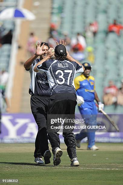 New Zealand bowler Daryl Tuffey and fielder Kyle Mills celebrate the dismissal of Sri Lanka batsman Sanath Jayasuriya on September 27, 2009 during...