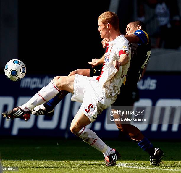 Uwe Moehrle of Augsburg is challenged by Everson of Koblenz during the Second Bundesliga match between FC Augsburg and Tus Koblenz at the Impuls...
