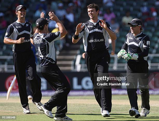 James Franklin of New Zealand celebrates the wicket of Kumar Sangakkara of Sri Lanka with team mates during the ICC Champions Trophy Group B match...