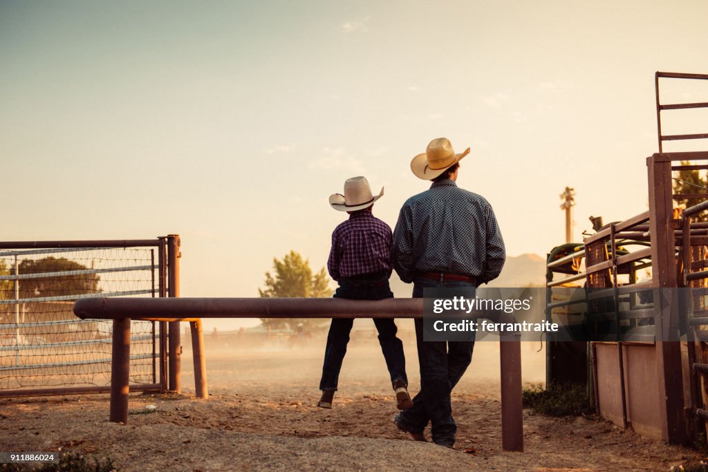 Father and son at rodeo arena