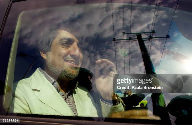 Afghan doctor, politician and independent candidate, Abdullah Abdullah, the top challenger to Presdeint Karzai in the controversial elections, waves...
