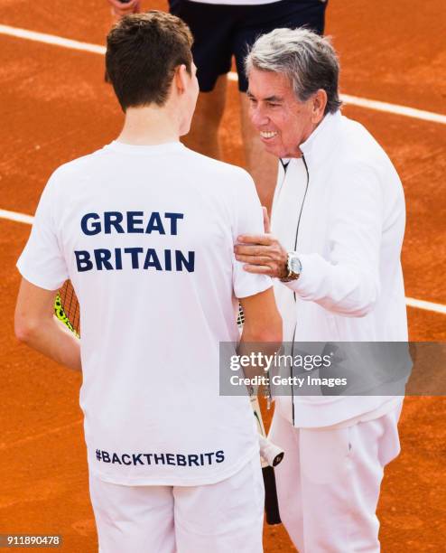 Manuel Santana of Spain meets members of the Great Britain Davis Cup team ahead of the Davis Cup by BNP Paribas World Group First Round match between...