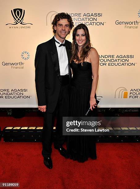 Tennis player Gustavo Kuerten and Mariana Somcini arrive at the 14th annual Andre Agassi Charitable Foundation's Grand Slam for Children benefit...