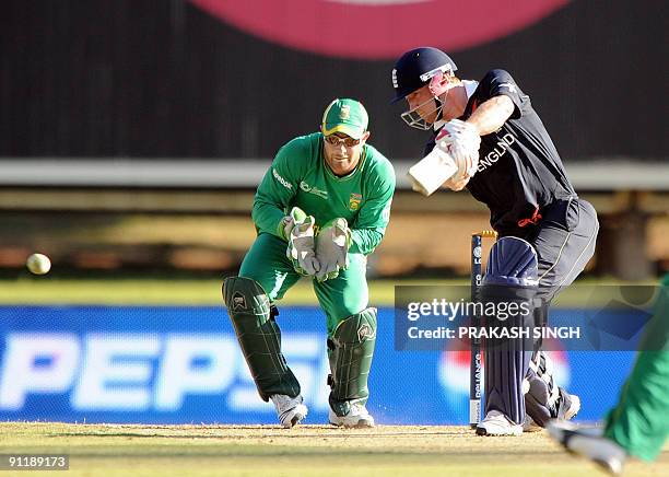 England's batsman Paul Collingwood plays a shot off South Africa's unseen bowler Johan Botha as Mark Boucher looks on during The ICC Champions Trophy...