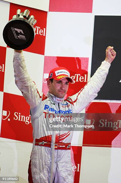 Timo Glock of Germany and Toyota celebrates on the podium after finishing second during the Singapore Formula One Grand Prix at the Marina Bay Street...