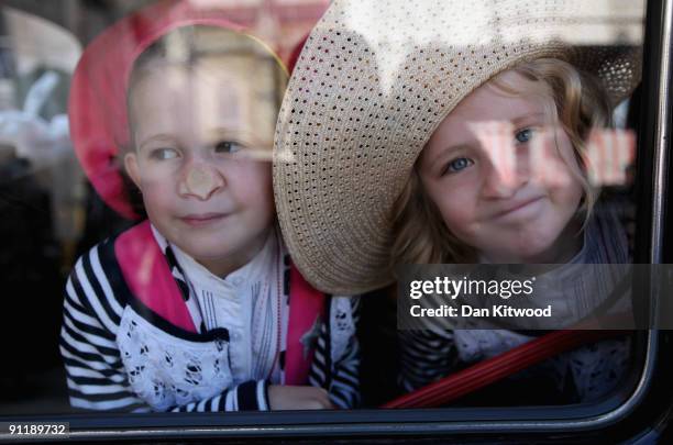 Two girls watch as the Pearly Kings and Queens gather to celebrate their annual Costermonger's Harvest Festival at the London Guildhall on September...