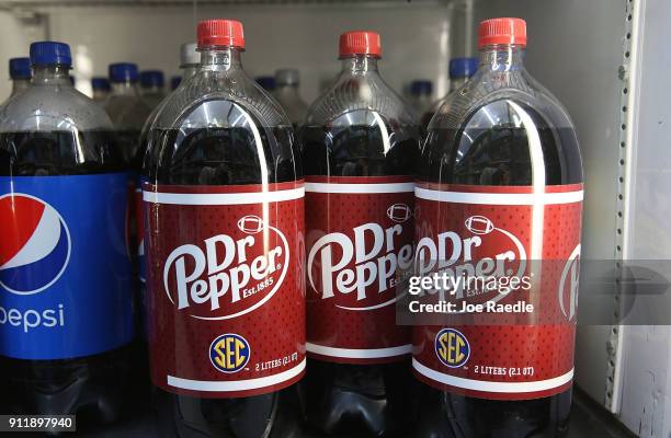 Bottles of Dr Pepper drinks are seen on a store shelf on the day Keurig Green Mountain announced it has struck a deal worth more than $21 billion...