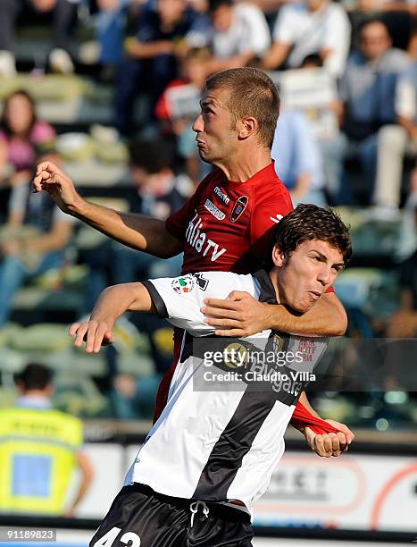 Alberto Paloschi of Parma FC competes for the ball with Michele Canini of Cagliari Calcio during the Serie A match between Parma FC and Cagliari...