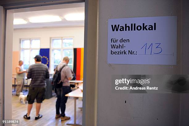 Residents cast their ballot at a polling station in German federal elections on September 27, 2009 in Berlin, Germany. Though the Christian Democrats...