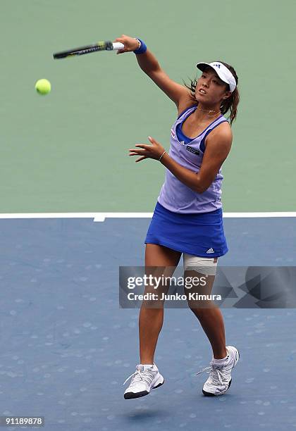 Ayumi Morita of Japan returns a shot against Alisa Kleybanova of Russia during day one of the Toray Pan Pacific Open Tennis tournament at Ariake...