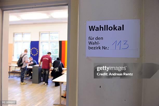 Residents cast their ballot at a polling station in German federal elections on September 27, 2009 in Berlin, Germany. Though the Christian Democrats...