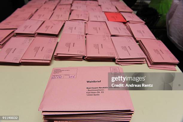 Mail-in ballots lay at a polling station in German federal elections on September 27, 2009 in Berlin, Germany. Though the Christian Democrats lead...