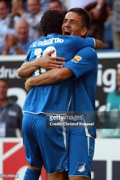 Vedad Ibisevic of Hoffenheim celebrates after scoring his team's second goal with team mate Carlos Eduardo of Hoffenheim during the Bundesliga match...