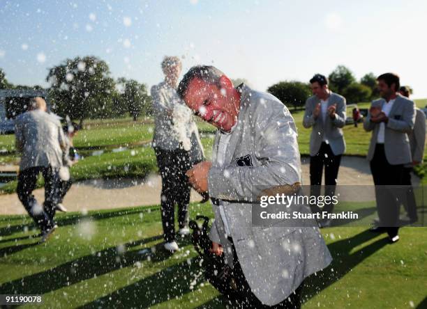 Paul McGinley, Captain of the Great Britain and Northern Ireland team is sprayed with champagne by team members after winning the final day singles...