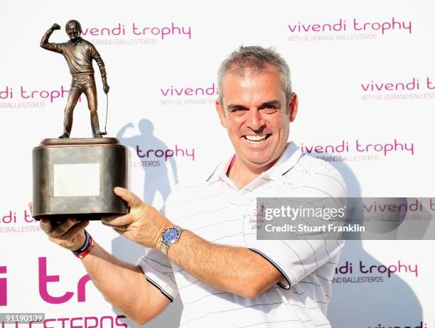 Paul McGinley, Captain of the Great Britain and Northern Ireland team holds the trophy after his team's winning performance during the final day...