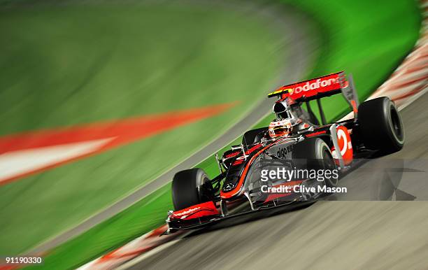 Heikki Kovalainen of Finland and McLaren Mercedes drives during the Singapore Formula One Grand Prix at the Marina Bay Street Circuit on September...