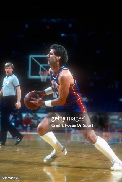 Kelly Tripucka of the Detroit Pistons looks to drives to the basket against the Washington Bullets during an NBA basketball game circa 1984 at the...
