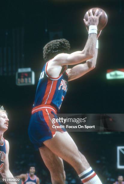 Kelly Tripucka of the Detroit Pistons grabs a rebound against the Washington Bullets during an NBA basketball game circa 1981 at the Capital Centre...