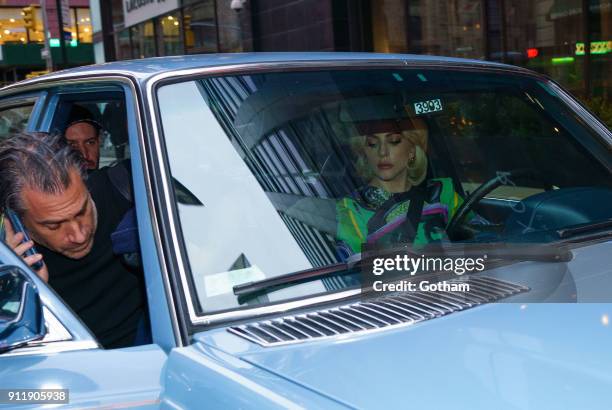 Lady Gaga drives Christian Carino in a classic Mercedes on January 29, 2018 in New York City.