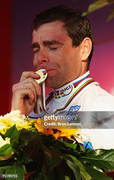 Cadel Evans of Australia kisses his gold medal after winning the Men's Road Race at the 2009 UCI Road World Championships on September 27, 2009 in...