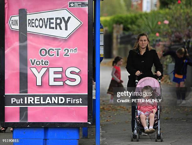 Campaign poster urging voters to 'Vote Yes' in a referendum on the Lisbon Treaty is pictured on a bus shelter in Dublin, in Ireland, on September 24,...