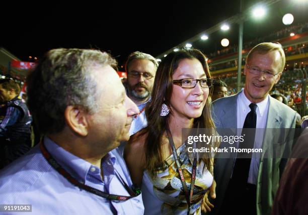 Presidential candidates Jean Todt and Ari Vatanen meet on the grid before the Singapore Formula One Grand Prix at the Marina Bay Street Circuit on...