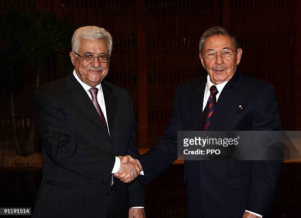 In this handout image provided by the Palestinian Press Office , Palestinian President Mahmoud Abbas meets with Cuban President Raul Castro on...