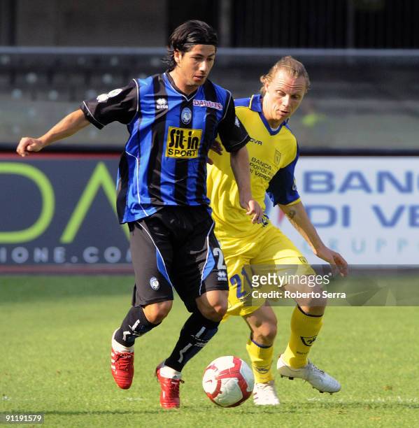 Jaime Valdes of Atalanta BC competes for the ball with Nicolas Sebastien Frey of Chievo Verona during the Serie A match between Chievo Verona and...