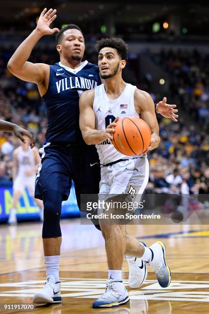 Marquette Golden Eagles guard Markus Howard drives on Villanova Wildcats guard Jalen Brunson during the game between the Marquette Golden Eagles and...