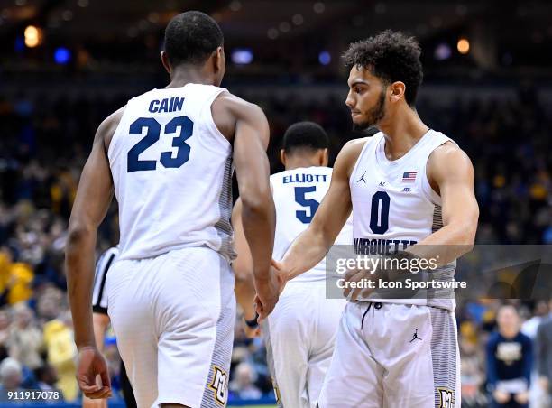 Marquette Golden Eagles forward Jamal Cain and Marquette Golden Eagles guard Markus Howard react during the game between the Marquette Golden Eagles...