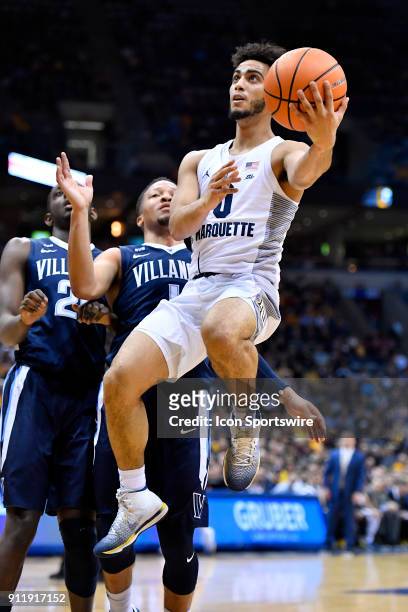 Marquette Golden Eagles guard Markus Howard shoots on Villanova Wildcats guard Jalen Brunson during the game between the Marquette Golden Eagles and...