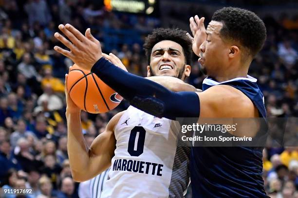 Marquette Golden Eagles guard Markus Howard drives on Villanova Wildcats guard Jalen Brunson during the game between the Marquette Golden Eagles and...