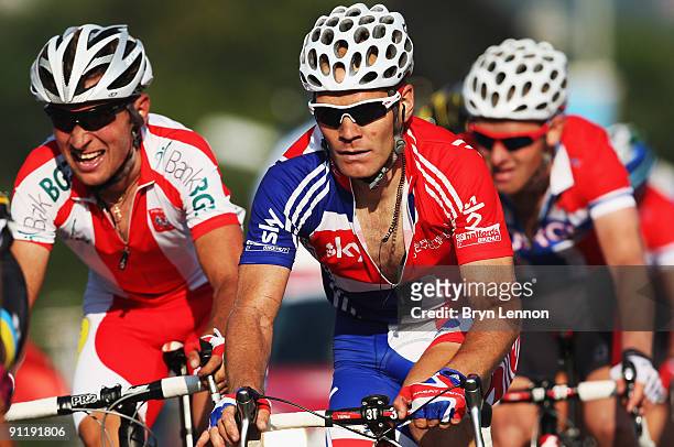 Roger Hammond of Great Brtiain rides in the peloton during the Men's Road Race at the 2009 UCI Road World Championships on September 27, 2009 in...