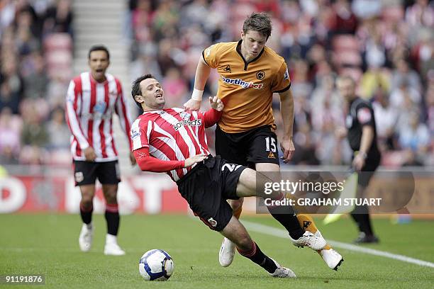 Sunderland's Andy Reid vies with Wolverhampton Wanderers' Greg Halford during an English FA Premier League, football match, at the Stadium of Light,...