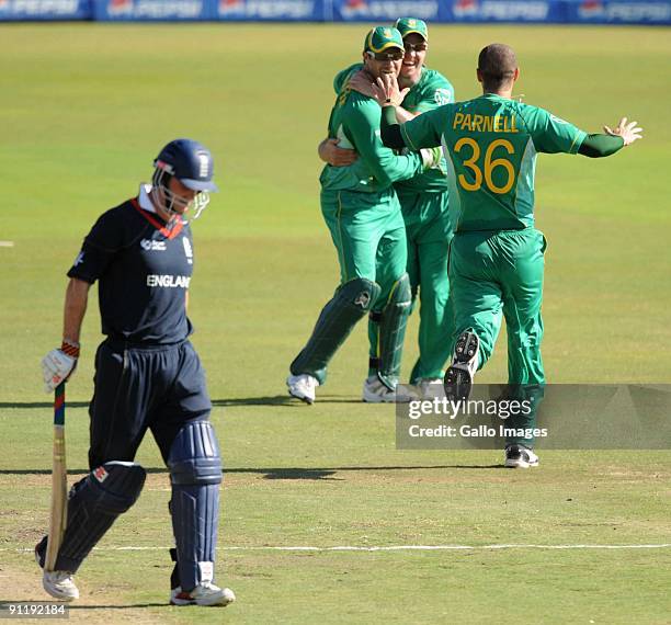 Mark Boucher, AB de Villiers and Wayne Parnell of South Africa celebrate the wicket of Andrew Strauss of England during The ICC Champions Trophym...