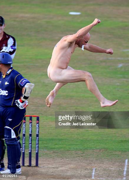 Streaker invades pitch and leaps the stumps during the NatWest Pro40: Division One match between Somerset and Durham at the County Cricket Ground on...