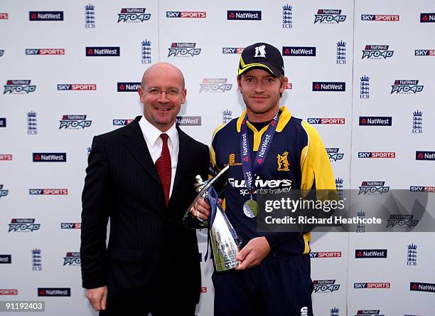 Warwickshire captain Ian Westwood recieves the division 2 trophy after winning the match during the NatWest Pro40 Division 2 match between Lancashire...