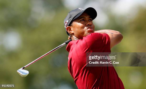 Tiger Woods tees off the second hole during the final round of THE TOUR Championship presented by Coca-Cola, the final event of the PGA TOUR Playoffs...