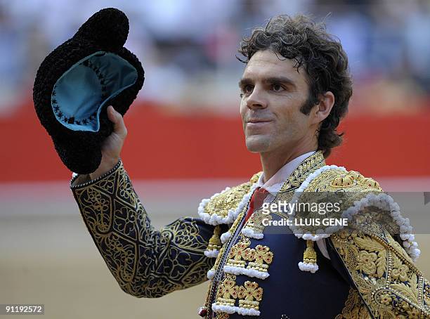 Spanish bullfighter Jose Tomas waves to the crowd after a bullfight at the Plaza Monumental bullring in Barcelona, on September 27, 2009. AFP...