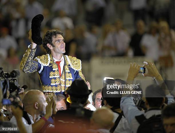 Spanish bullfighter Jose Tomas waves to the crowd after a bullfight at the Plaza Monumental bullring in Barcelona, on September 27, 2009. AFP...