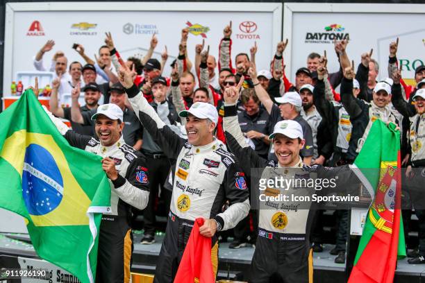 The Action Express Racing Cadillac DPi-V.R. Team of Filipe Albuquerque, Joao Barbosa and Christian Fittipaldi celebrates in Victory Lane following...